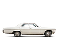 Side view of a vintage car on a white background